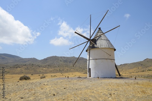 Amazing andalusian windmill in the Cabo de Gata-Níjar Natural Park, El Pozo de los Frailes, Almeria, Andalusia, Spain