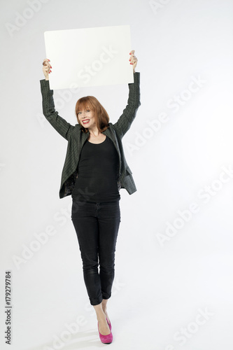 woman holding a sign