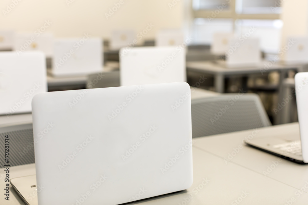 Modern office, work desks with laptops. In depth photography. Modern office, work desks with laptops. In depth photography.