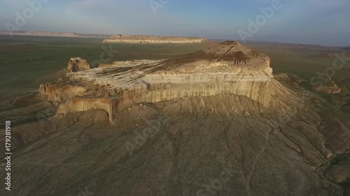 Flying a drone over the mountain Sherkala. Sunset 3 25fps photo