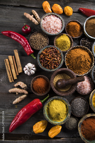 Fototapeta Naklejka Na Ścianę i Meble -  Variety of spices and herbs on kitchen table