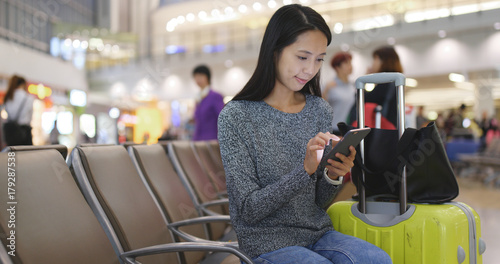 Photography Woman use of mobile phone in Hong Kong airport