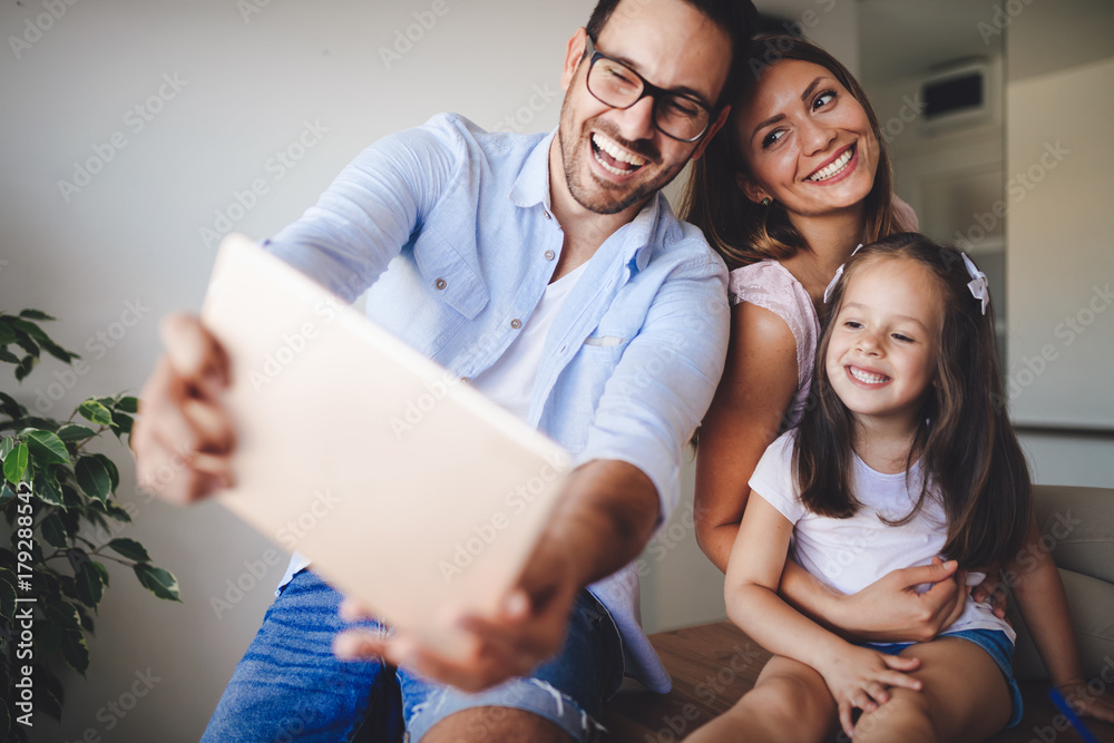 Happy family taking selfie in their house Happy family taking selfie in their house