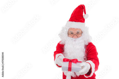 Happy merry Christmas Santa Claus pointing holding Gift Box with Isolated on white background. © kasipat