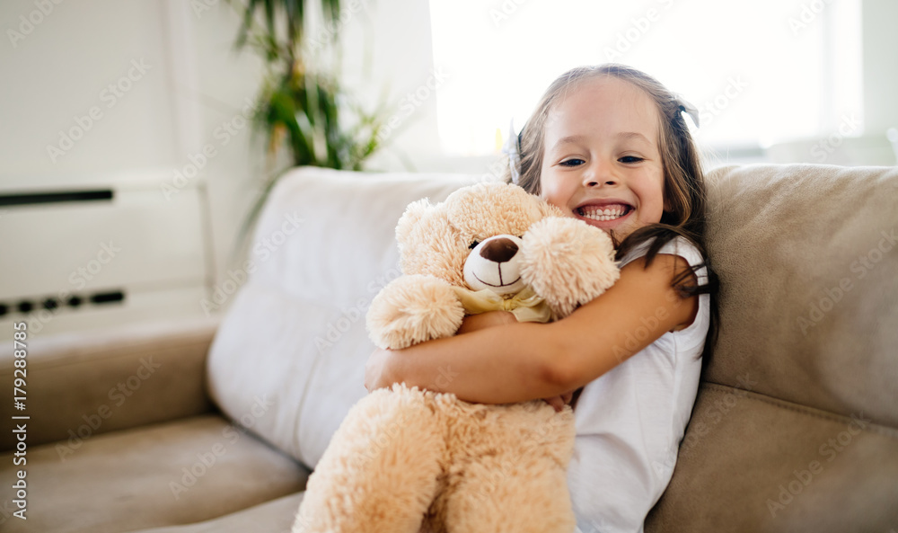 Cute little girl playing with teddy bear Cute little girl playing with teddy bear