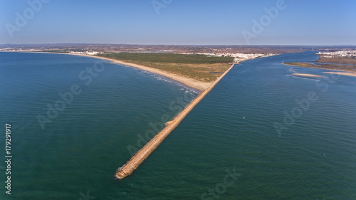 Aerial. Breakwater on the Guadiana River in city Vila Real Santo Antonio. Portugal photo