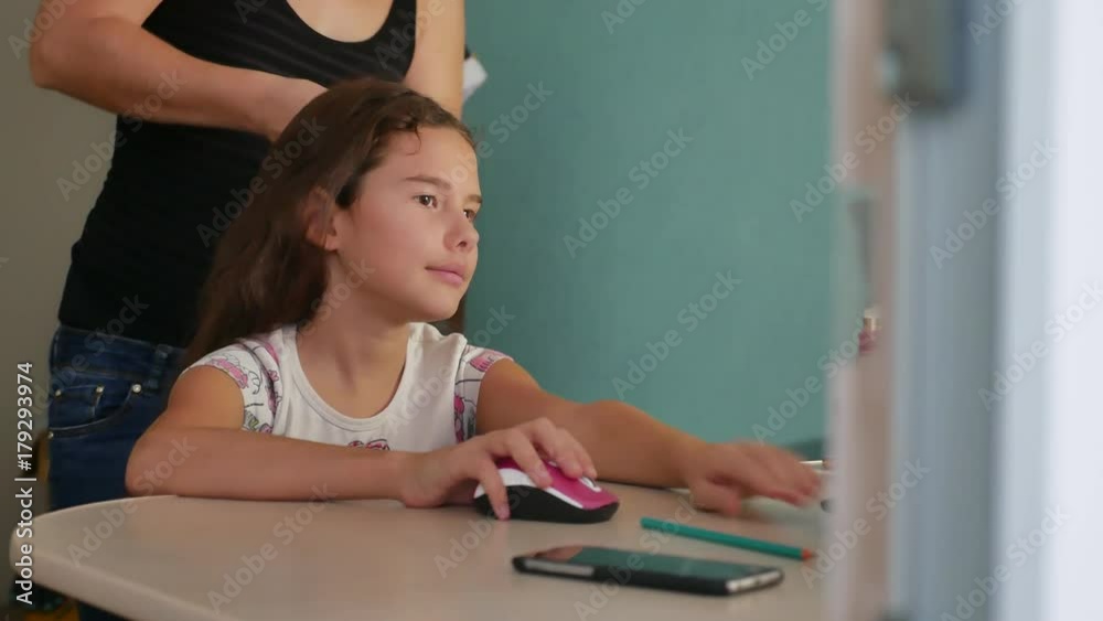 mom woman doing daughter indoor her hairstyle to her little girl teenager mom woman doing daughter indoor her hairstyle to her little girl teenager