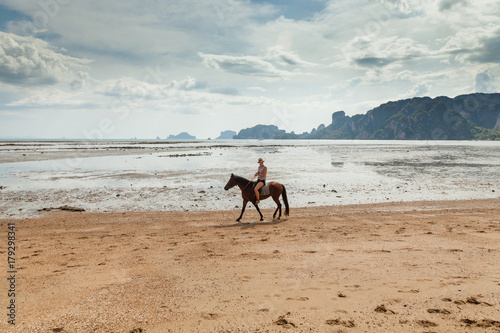 Thailand, Krabi. Beautiful woman on a horse.