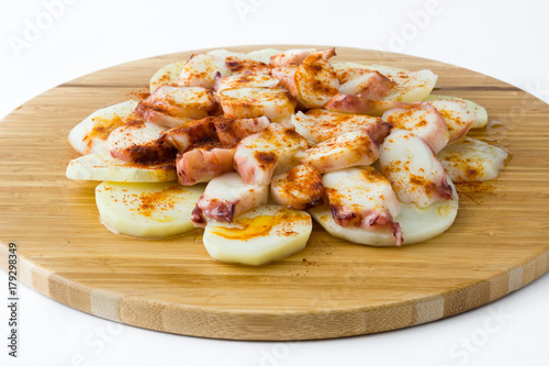 Pulpo a la gallega. Galician octopus on wood. Typical spanish food isolated on white background 