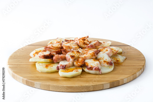 Pulpo a la gallega. Galician octopus on wood. Typical spanish food isolated on white background 
