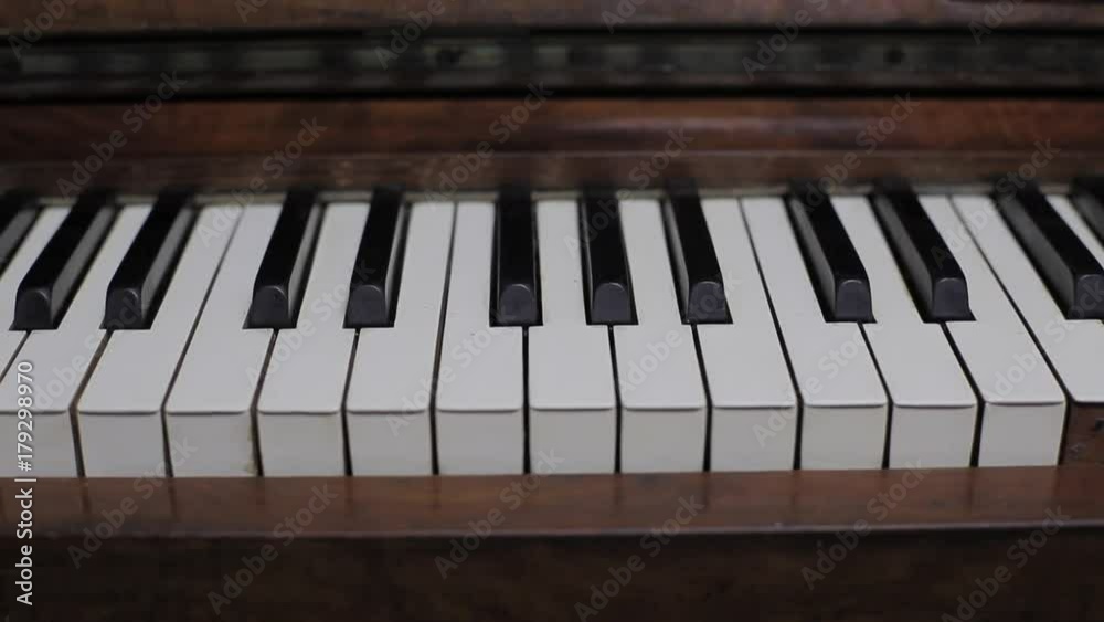 Slow tracking shot close up piano bass clef keys Slow tracking shot close up piano bass clef keys