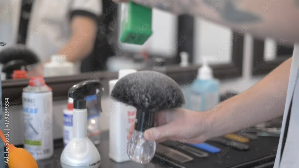 Barbershop dust. Powder in the hands of a man. Barbershop dust. Powder in the hands of a man.