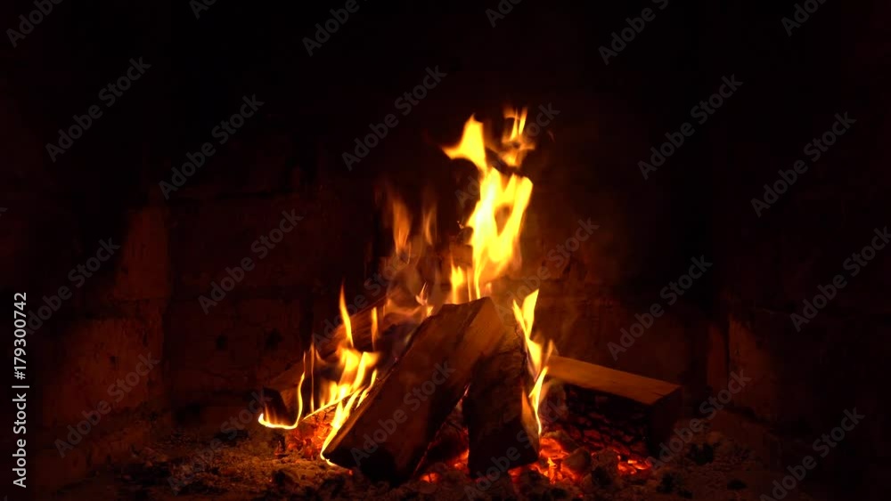 A fire burns in a fireplace, Fire to keep warm A fire burns in a fireplace, Fire to keep warm