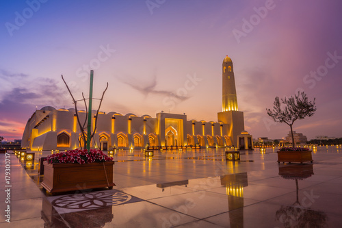 Imam Muhammad ibn Abd al-Wahhab Mosque (Qatar State Mosque) exterior view at sunset with clouds in the sky photo
