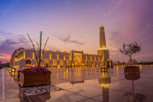 Imam Muhammad ibn Abd al-Wahhab Mosque (Qatar State Mosque) exterior view at sunset with clouds in the sky
