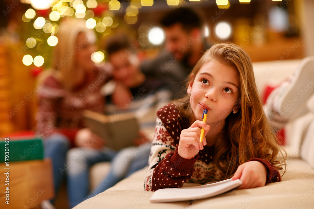 cute girl writes letter to Santa Claus for Christmas. cute girl writes letter to Santa Claus for Christmas.