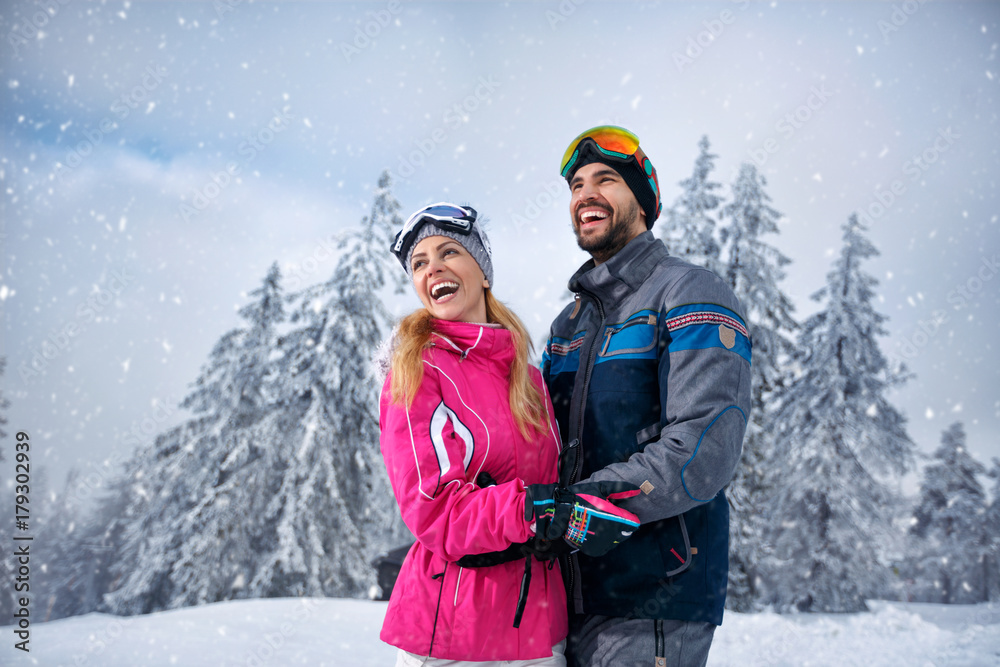 Beautiful smiling couple enjoying in winter vacations Beautiful smiling couple enjoying in winter vacations