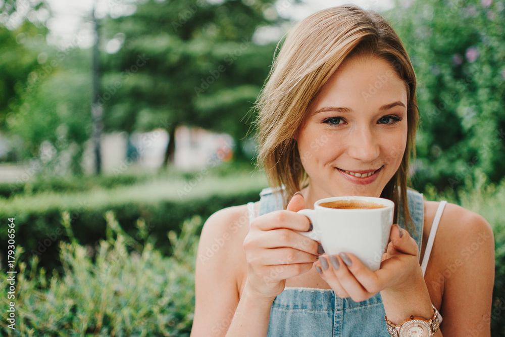young girl casual drinking hot drink inthe exterior Street young girl casual drinking hot drink inthe exterior Street