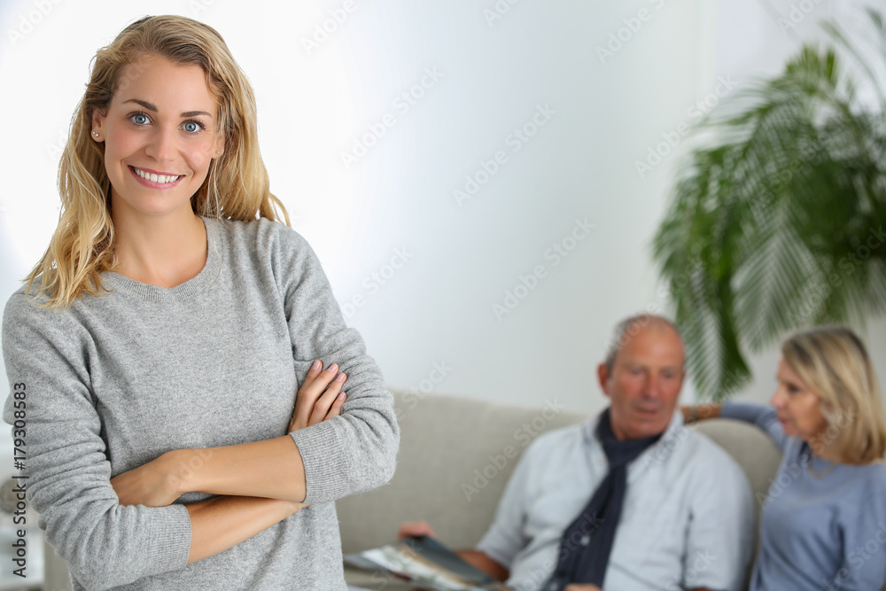 Obraz premium daughter with parents in background
