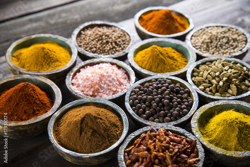 Spices, herbs on a wooden table