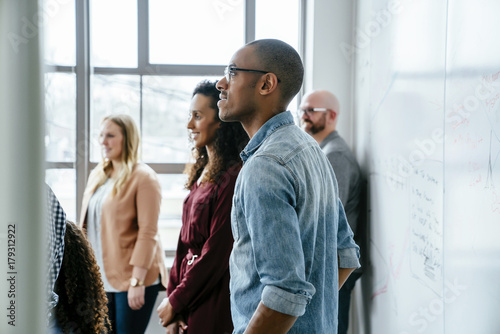 Business people near whiteboard