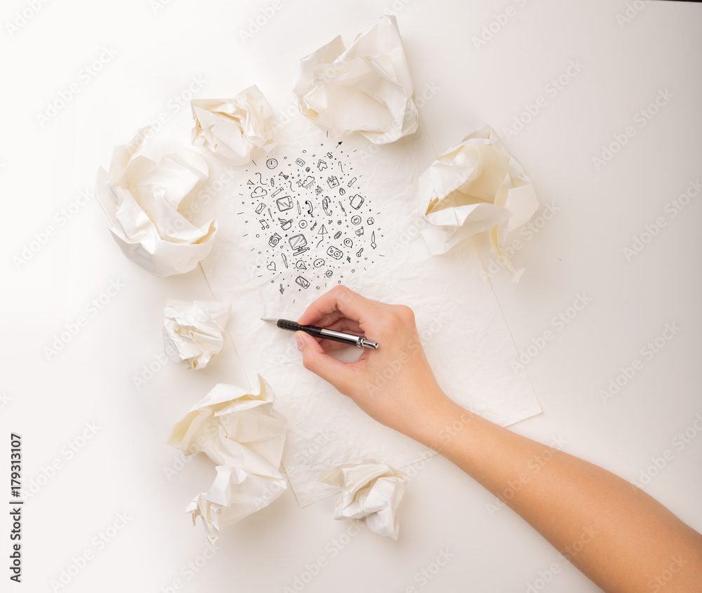 Fototapeta premium Writing hand in crumpled paper