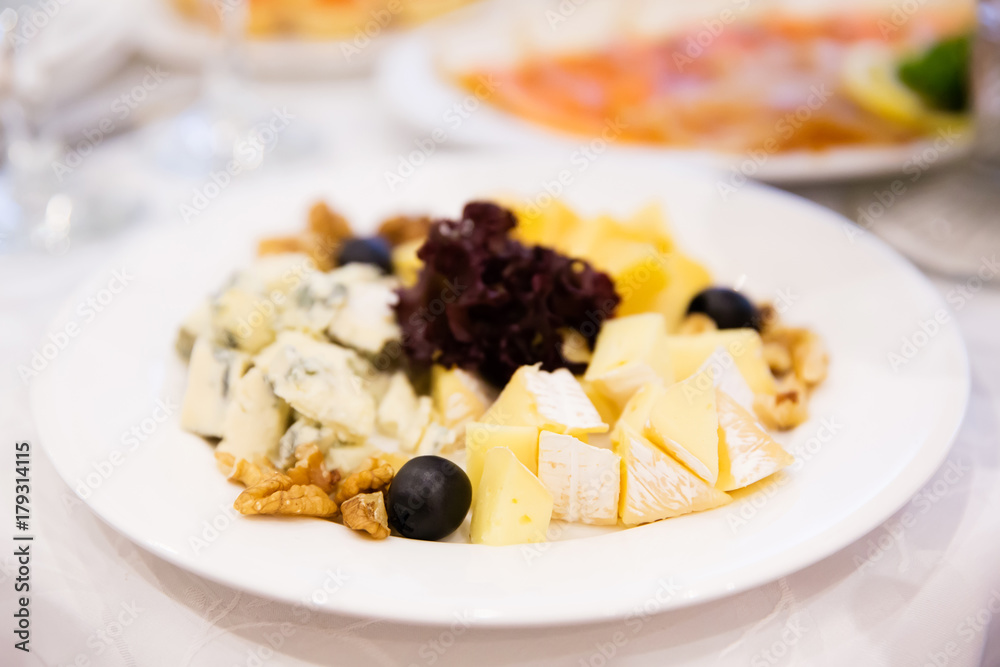 Cheese plate on the table in restaurant Cheese plate on the table in restaurant