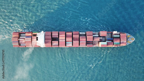 underway - LARGE container ship fully loaded with containers and cargo - aerial 4k view top down