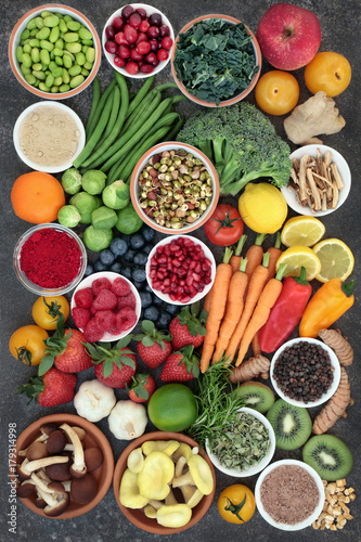 Fototapeta Naklejka Na Ścianę i Meble -  Large health food collection with fruit, vegetables with spices and herbs also used in natural herbal medicine. Superfoods concept with foods high anthocyanins, fiber, antioxidants and vitamins.