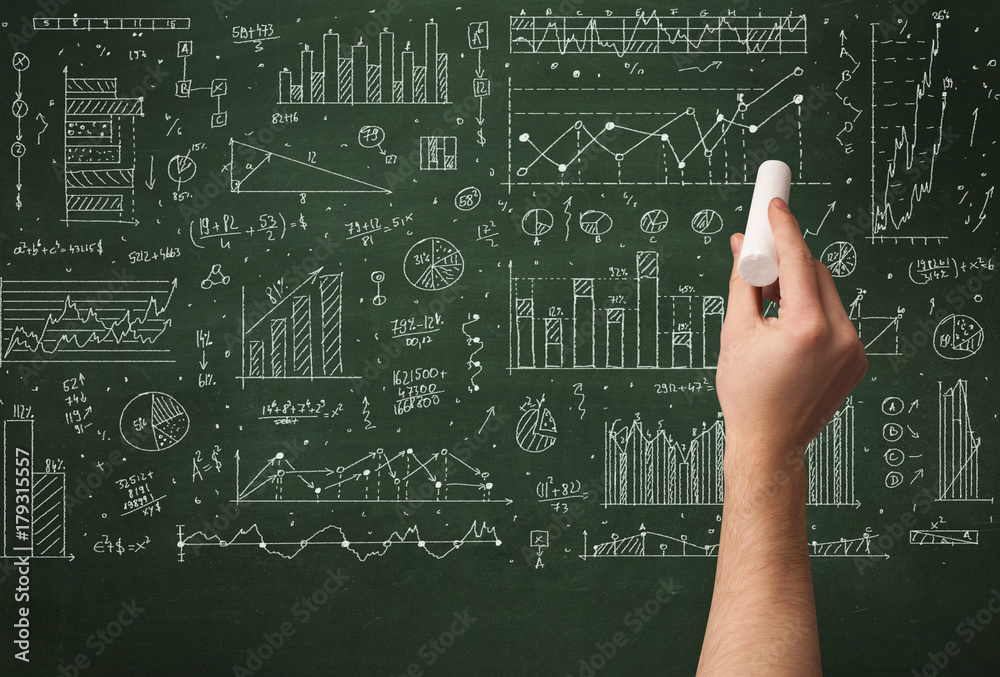 A business person drawing data on chalkboard A business person drawing data on chalkboard