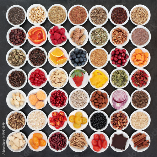 Large health food collection with ingredients for a healthy heart with vegetables, fruit, nuts, seeds, cereals, grains, pulses, spice and medicinal herbs. High in omega 3, antioxidants and vitamins.