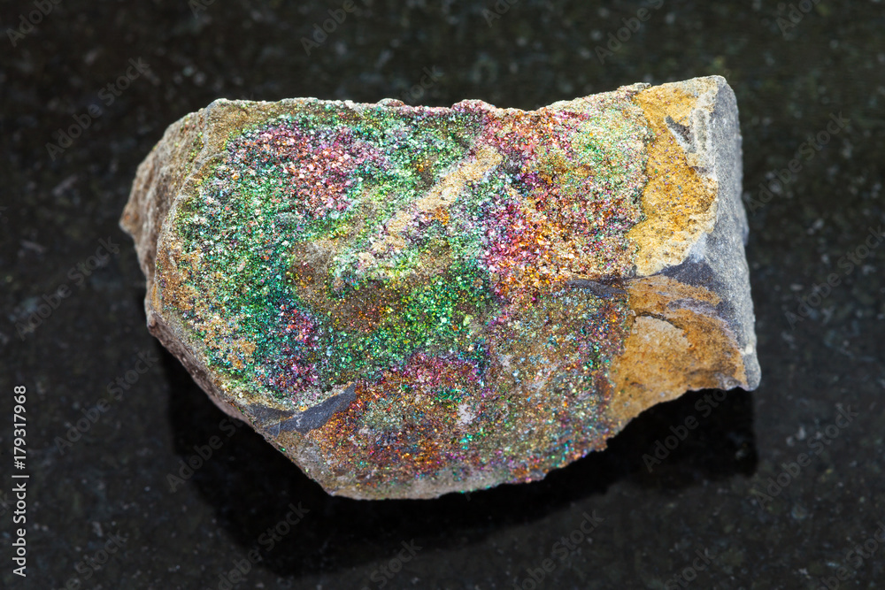 raw rainbow pyrite stone on dark background raw rainbow pyrite stone on dark background