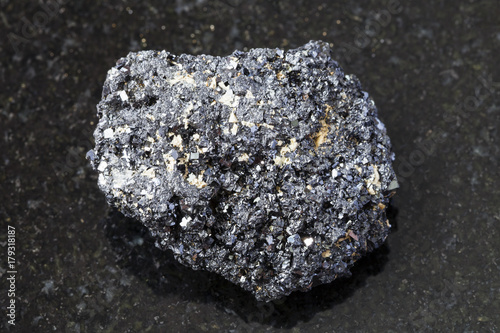 crystalline Perovskite stone on dark background