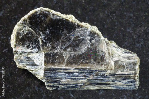 rough muscovite mica stone on dark background