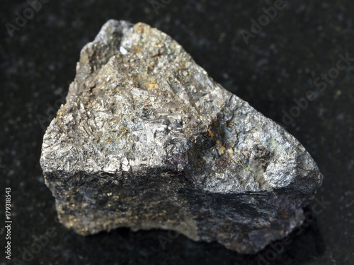 rough Arsenopyrite stone on dark background