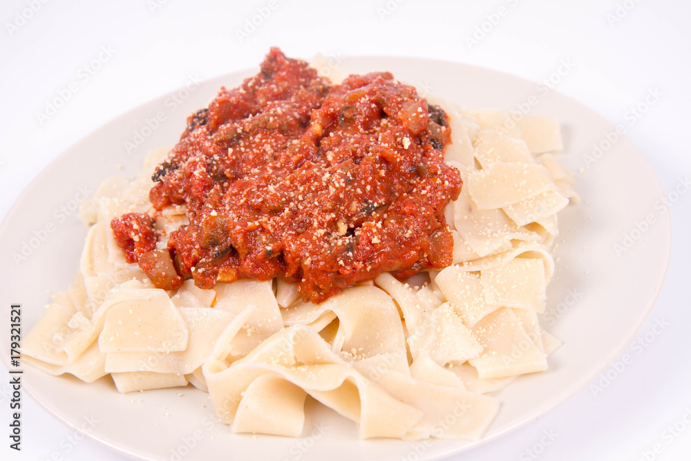 Pappardelle with bolognese sauce on a white background Pappardelle with bolognese sauce on a white background