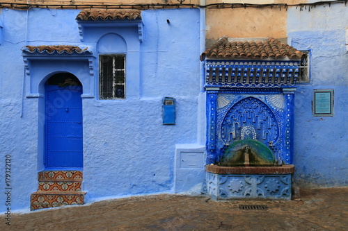 Traditional public fountain on a street in Chefchaouen, Morocco © juanorihuela