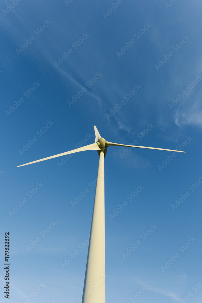 Wind turbines of a power plant for electricity generation in Normandy, France. Concept of renewable sources of energy. Environmentally friendly electricity production. Toned Wind turbines of a power plant for electricity generation in Normandy, France. Concept of renewable sources of energy. Environmentally friendly electricity production. Toned