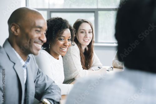 Business people laughing in meeting