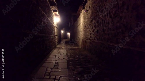 Walking POV in An old-fashioned Dark Alleyway photo