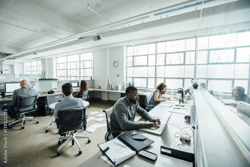 Business people working in busy office Business people working in busy office