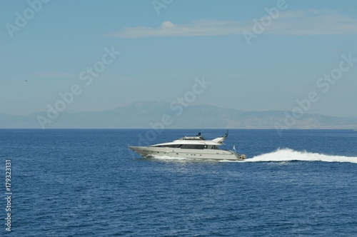 private yacht cruising on sea  © Robert