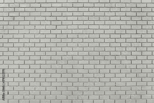 Old grey brick wall background texture
