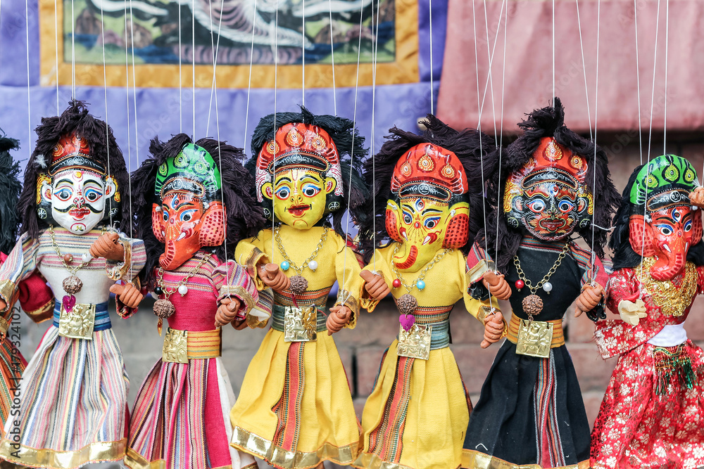 colorful Nepalese string puppets souvenir at market 