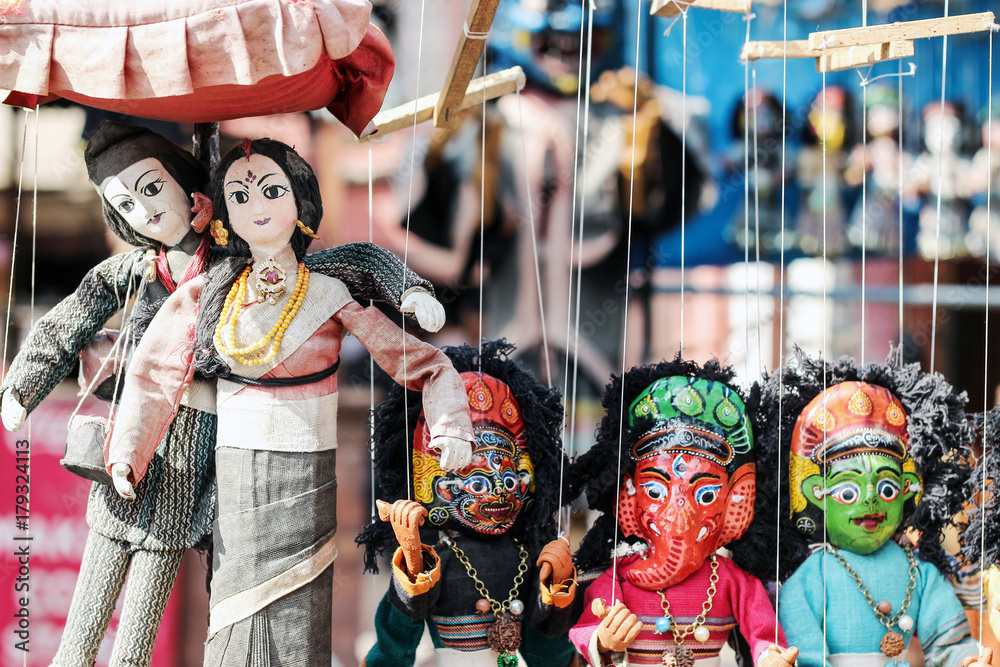 colorful Nepalese string puppets souvenir at market 
