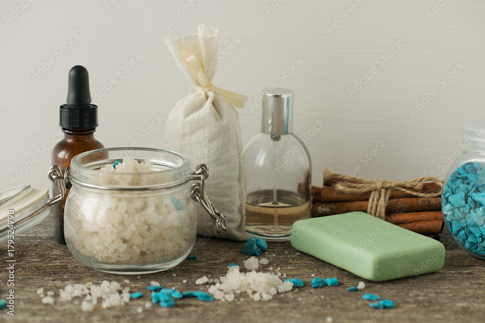 Bathroom accessories soap oils sea salt lavender aroma sachet on wooden desk toned selective focus