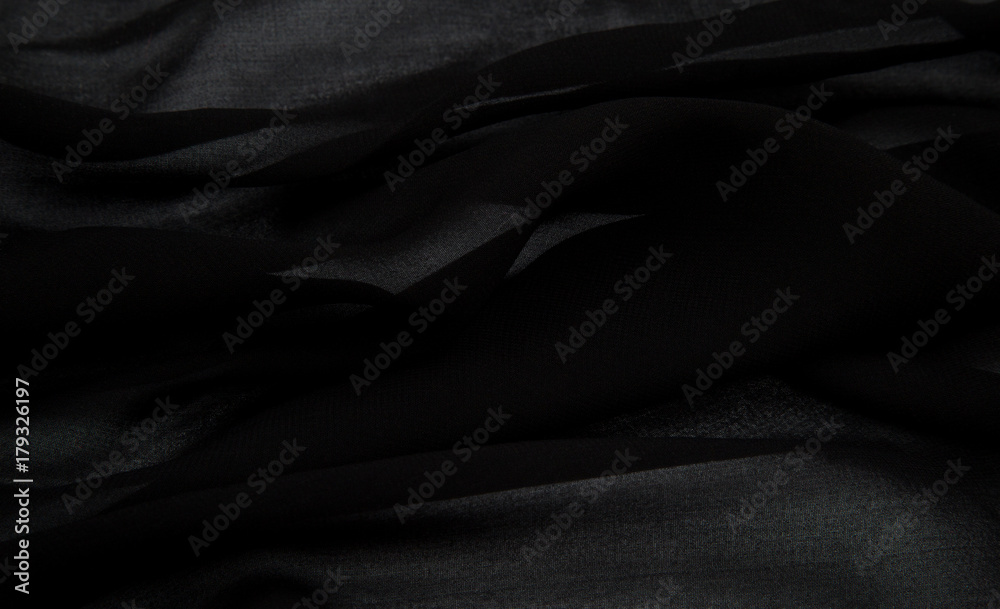 a delicate faux silk fabric in black color lined with soft folds