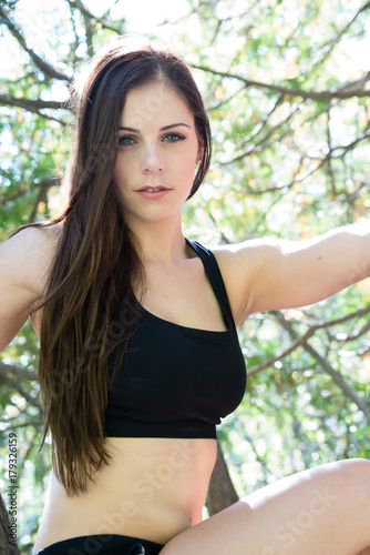 Selfie photo of a beautiful confident young woman doing fitness exercise