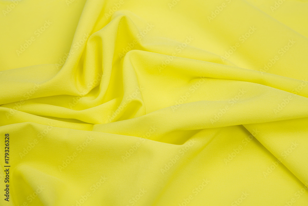 a delicate faux silk fabric yellow lined with soft folds a delicate faux silk fabric yellow lined with soft folds
