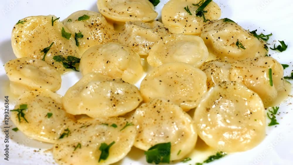 Making of dumplings. Dumplings are decorated with greens. Making of dumplings. Dumplings are decorated with greens.